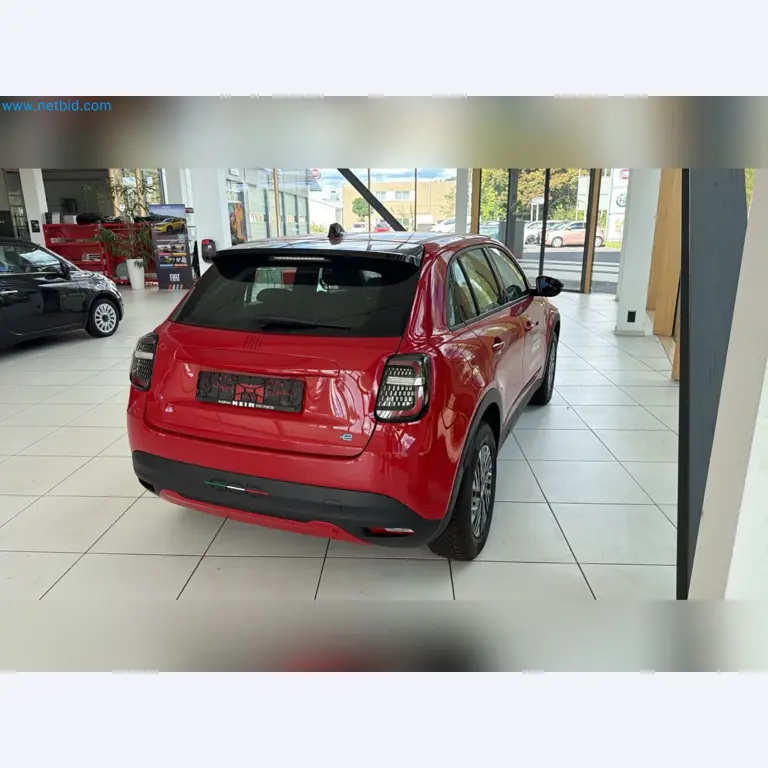 Passenger cars, electric cars, and automotive repair shop equipment at a Fiat dealership-5