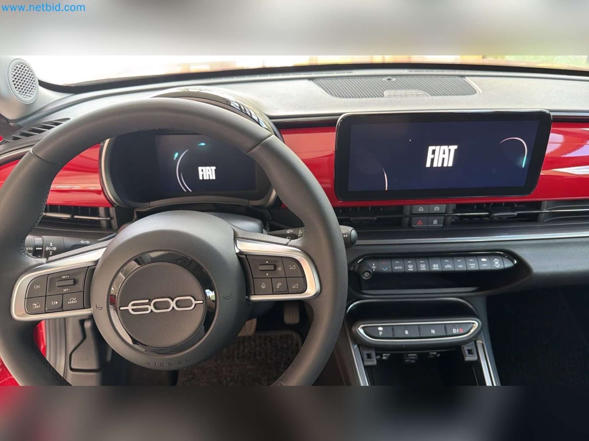 Passenger cars, electric cars, and automotive repair shop equipment at a Fiat dealership-8