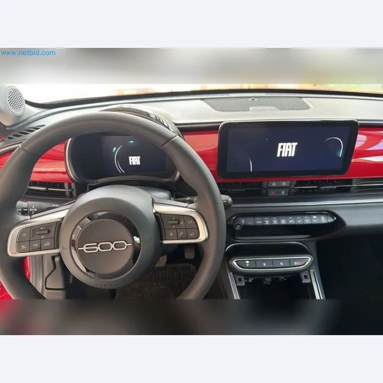 Passenger cars, electric cars, and automotive repair shop equipment at a Fiat dealership-8