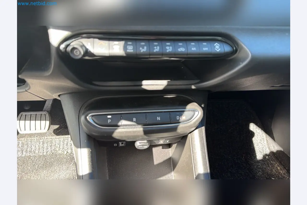 Passenger cars, electric cars, and automotive repair shop equipment at a Fiat dealership-9