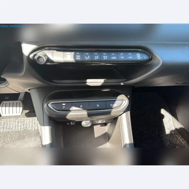 Passenger cars, electric cars, and automotive repair shop equipment at a Fiat dealership-9
