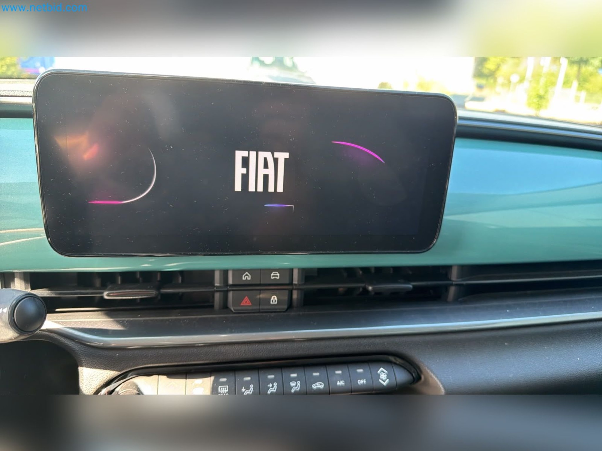 Passenger cars, electric cars, and automotive repair shop equipment at a Fiat dealership-11