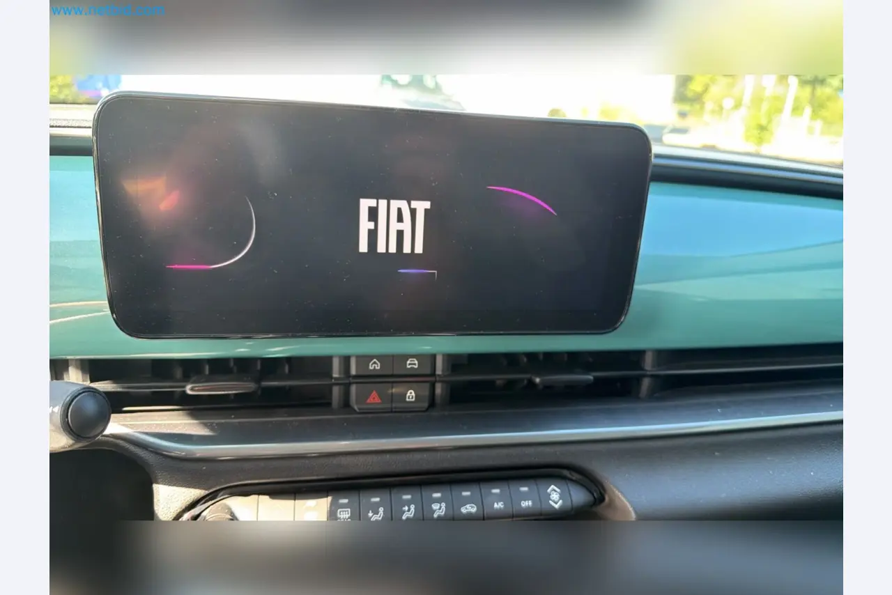 Passenger cars, electric cars, and automotive repair shop equipment at a Fiat dealership-11