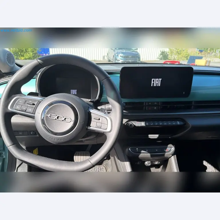 Passenger cars, electric cars, and automotive repair shop equipment at a Fiat dealership-13