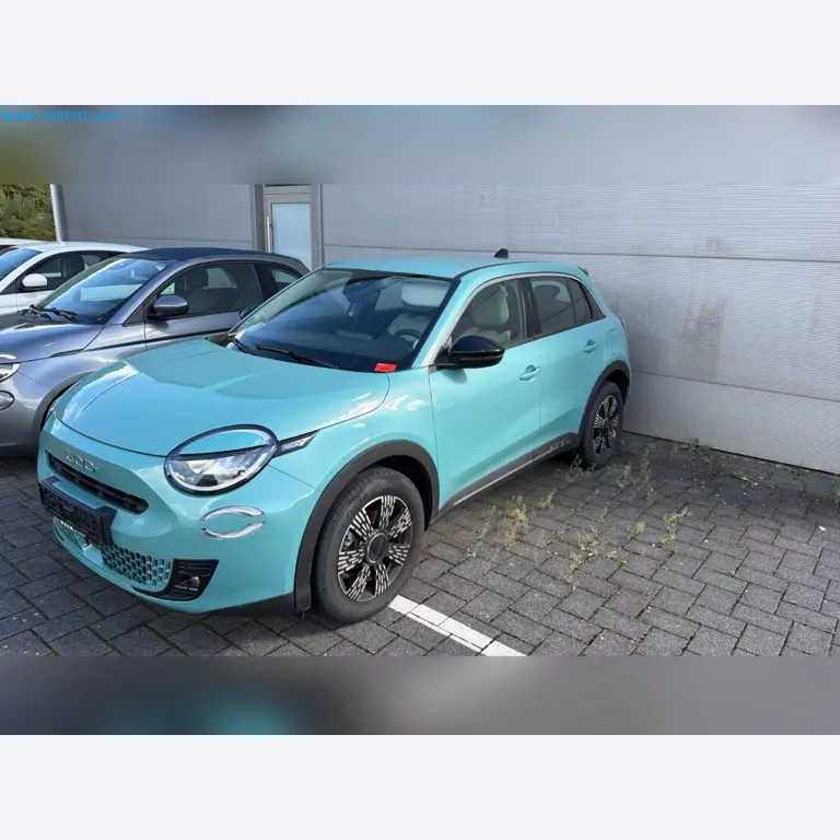 Passenger cars, electric cars, and automotive repair shop equipment at a Fiat dealership-1