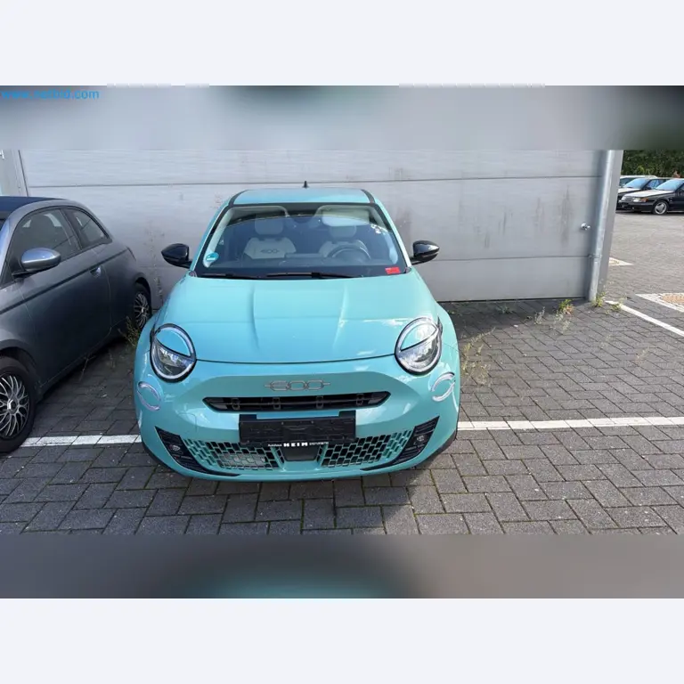 Passenger cars, electric cars, and automotive repair shop equipment at a Fiat dealership-2