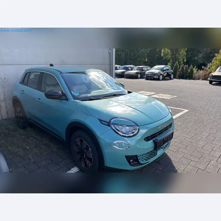 Passenger cars, electric cars, and automotive repair shop equipment at a Fiat dealership-3