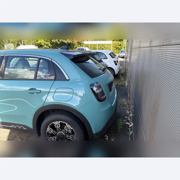 Passenger cars, electric cars, and automotive repair shop equipment at a Fiat dealership-4