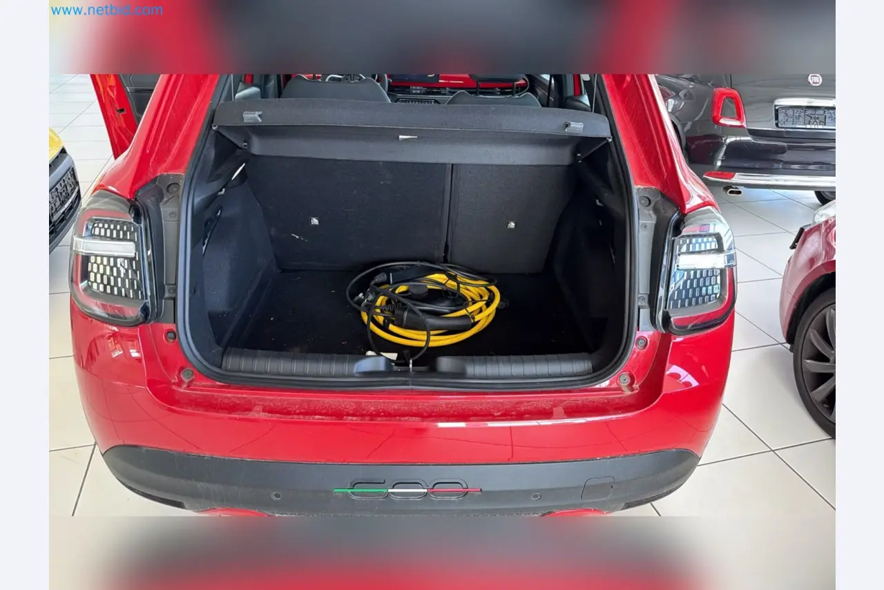 Passenger cars, electric cars, and automotive repair shop equipment at a Fiat dealership-10