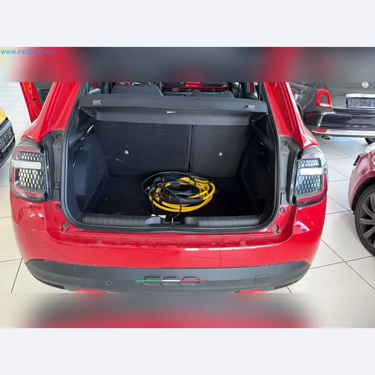 Passenger cars, electric cars, and automotive repair shop equipment at a Fiat dealership-10