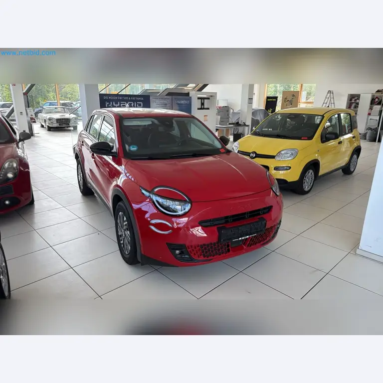 Passenger cars, electric cars, and automotive repair shop equipment at a Fiat dealership-1