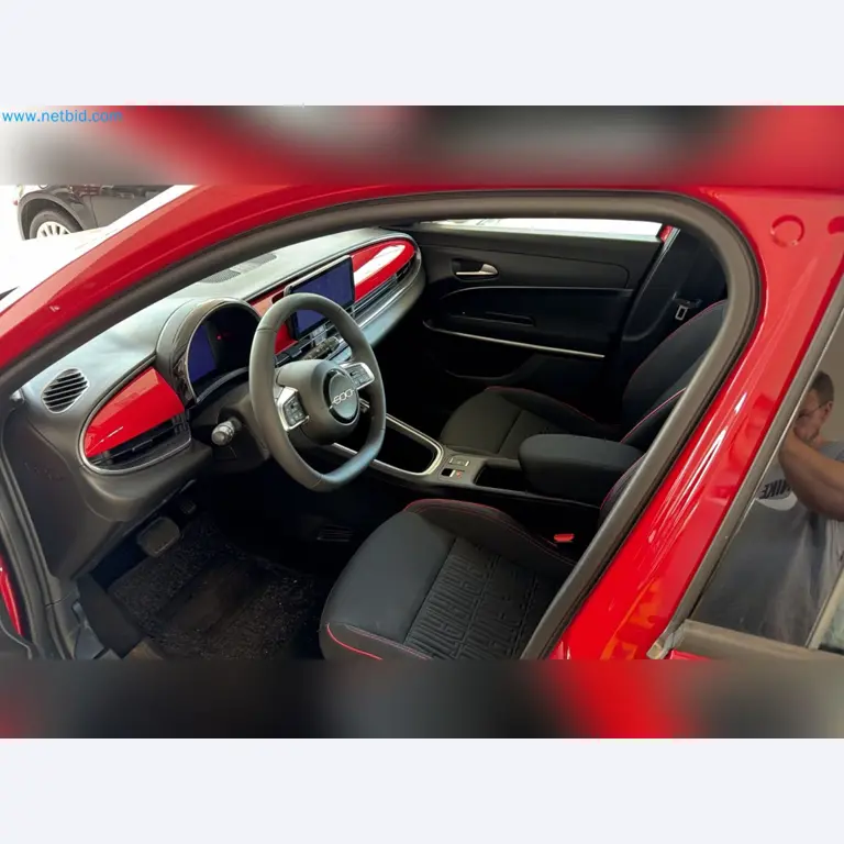 Passenger cars, electric cars, and automotive repair shop equipment at a Fiat dealership-4
