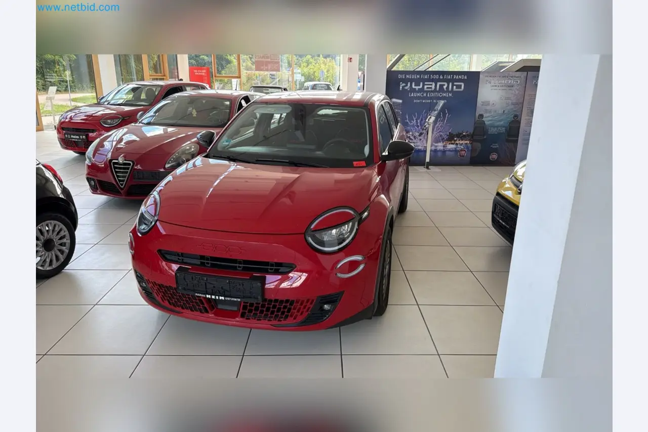 Passenger cars, electric cars, and automotive repair shop equipment at a Fiat dealership-5
