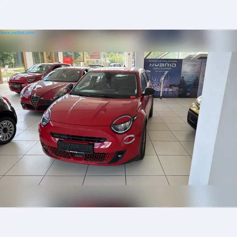 Passenger cars, electric cars, and automotive repair shop equipment at a Fiat dealership-5