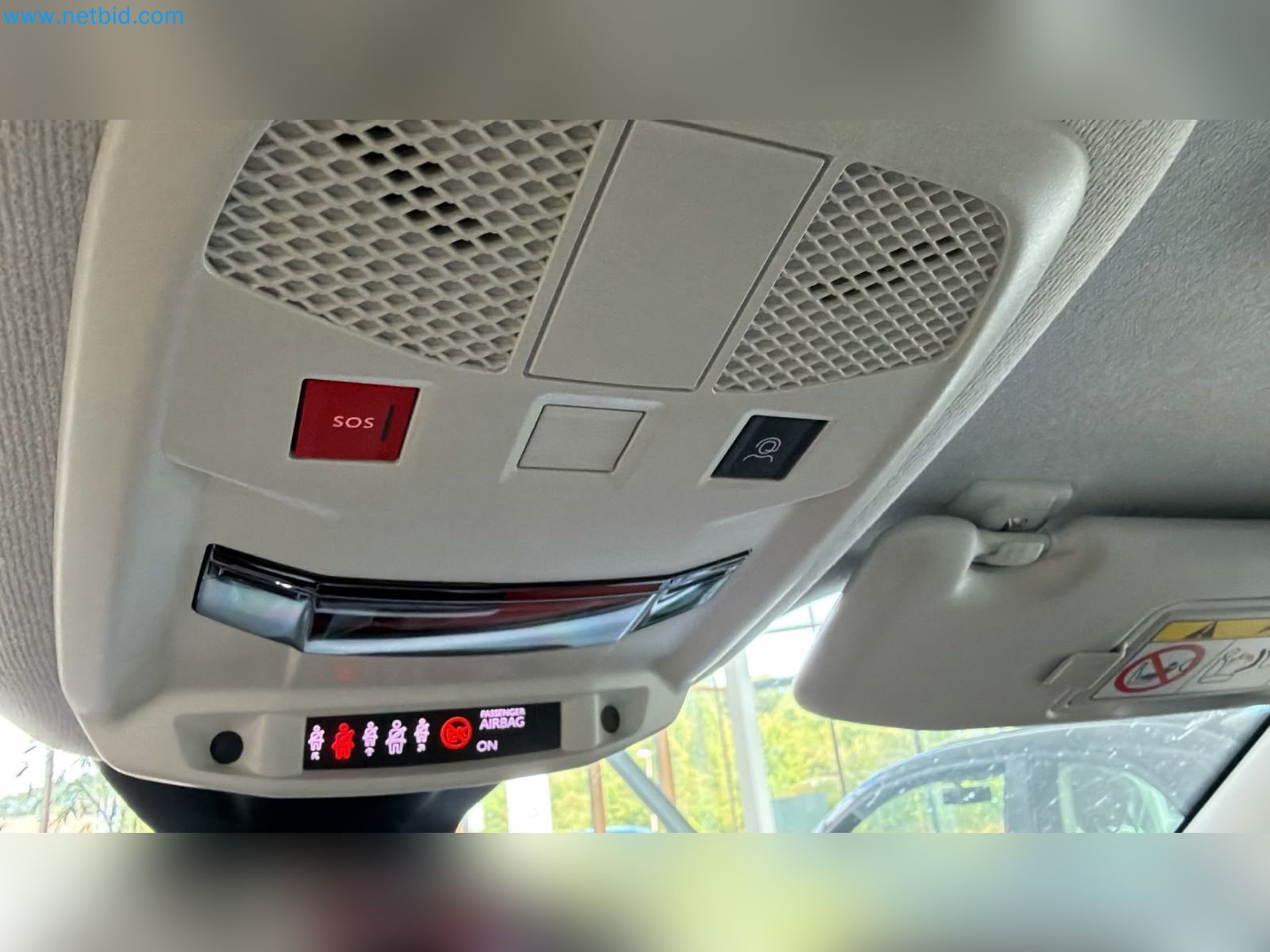 Passenger cars, electric cars, and automotive repair shop equipment at a Fiat dealership-7