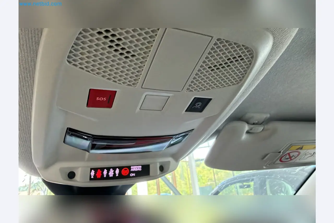 Passenger cars, electric cars, and automotive repair shop equipment at a Fiat dealership-7