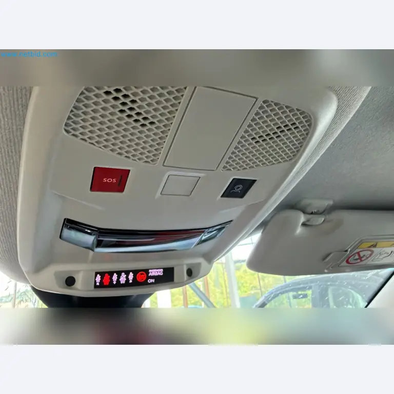 Passenger cars, electric cars, and automotive repair shop equipment at a Fiat dealership-7