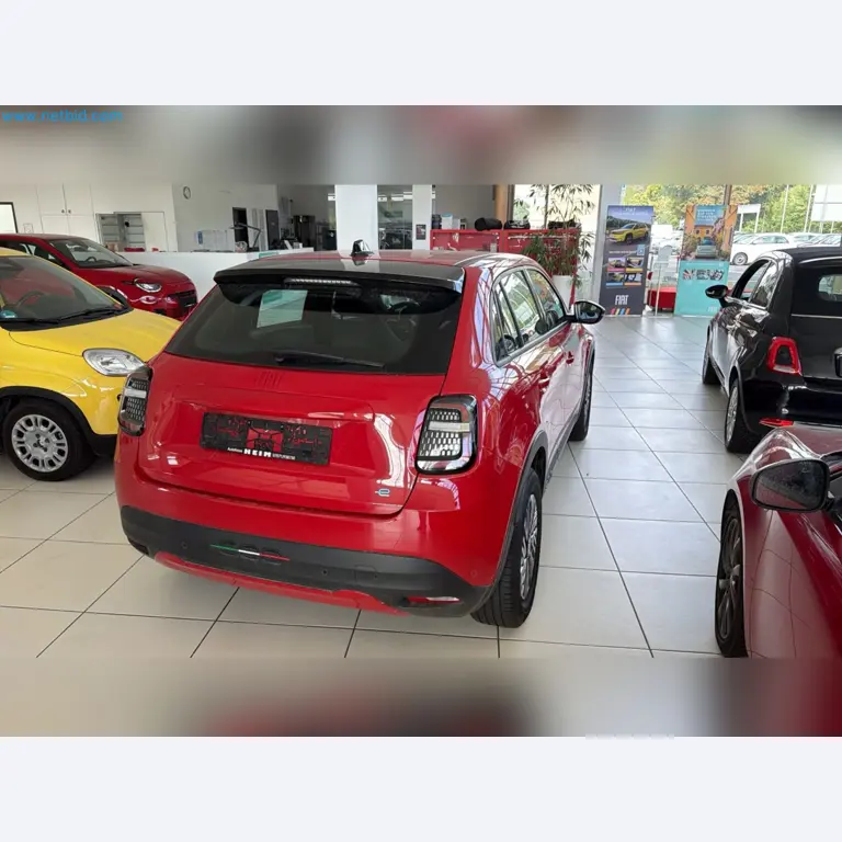 Passenger cars, electric cars, and automotive repair shop equipment at a Fiat dealership-9